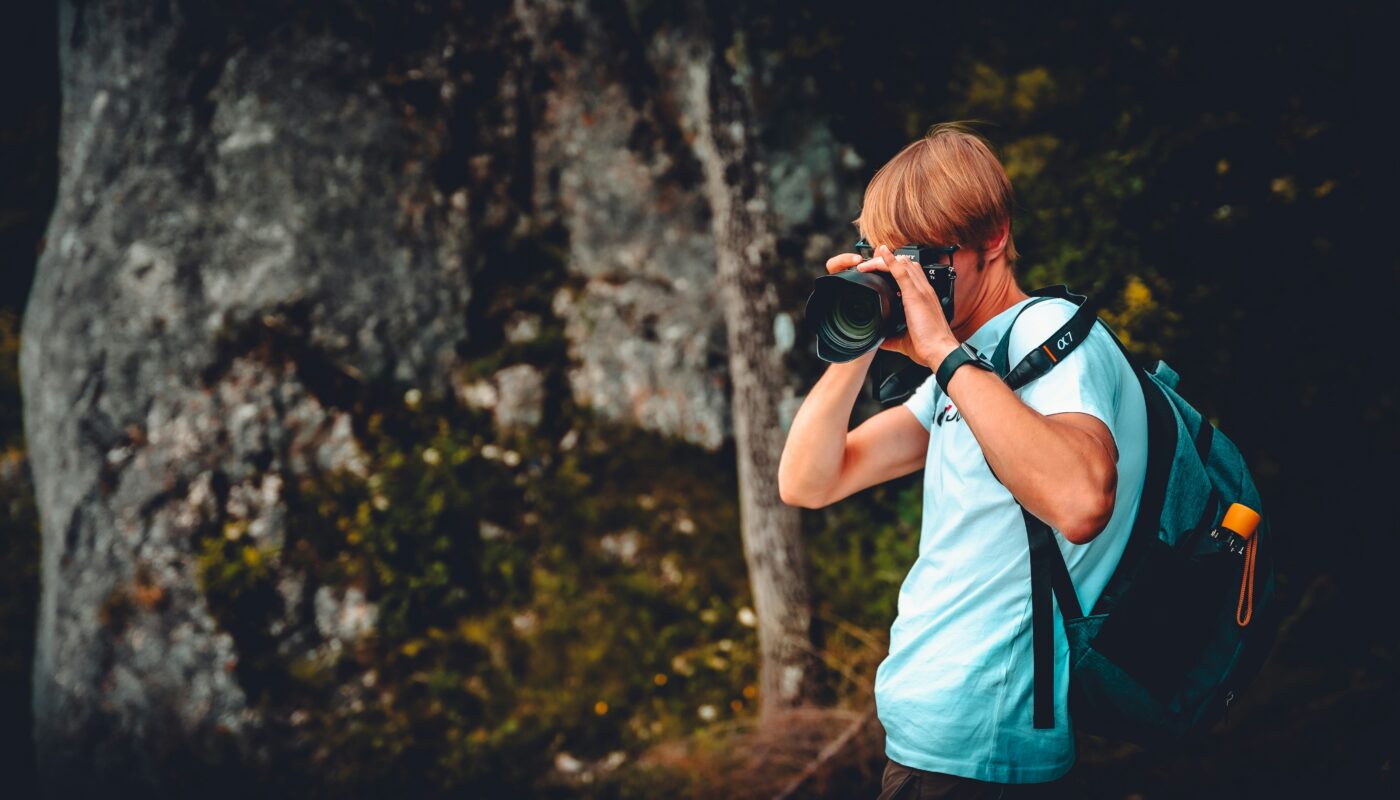 https://unsplash.com/photos/woman-in-white-shirt-taking-photo-using-black-dslr-camera-IorNTqnXGw8