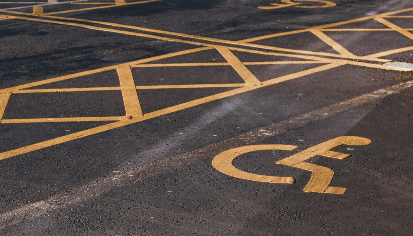 https://www.pexels.com/photo/disabled-parking-signs-on-asphalt-pavement-11074302/